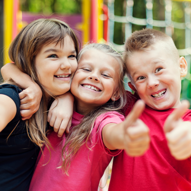 Photo of smiling children participating in an engaging English learning activity designed by MEA